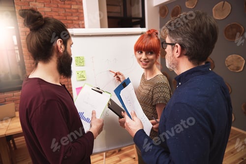 Preview: Group of people analyzing the result of work