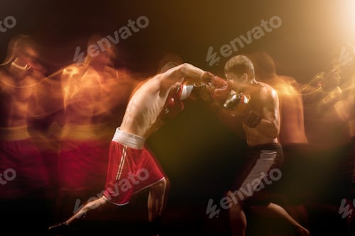 Preview: The two male boxers boxing in a dark studio