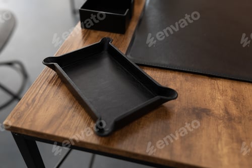 Preview: accessory for stationery made of genuine leather on a working wooden table in the office