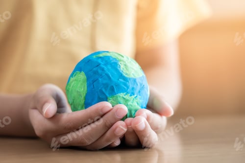 Preview: Hands holding earth paper and water paint. Concept of sustainability environment protection
