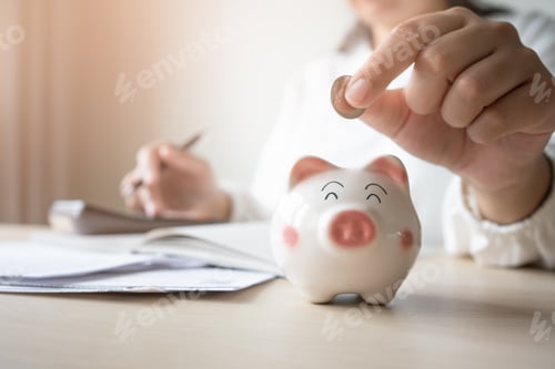Preview: Money save concept woman put coin in piggy bank. Coin currency deposit for household expense.