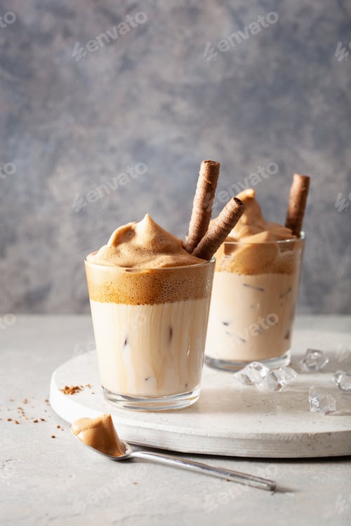 Preview: dalgona coffee in glass. trendy Instant coffee whipped with sugar and hot water