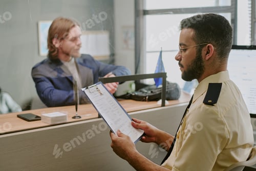 Preview: Reviewing Document at Reception Desk