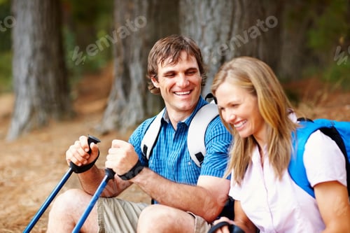 Preview: Happy couple taking a break from trekking