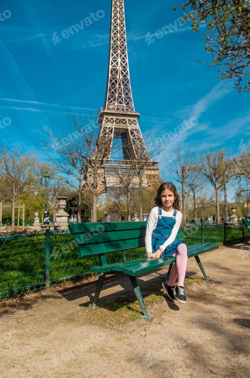 Preview: Children in Paris near the Eiffel Tower. Selective focus.