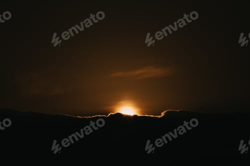 Preview: Super sunset over the black clouds wallpaper on moody tones with copy space and orange tones