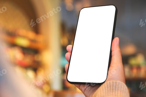 Preview: Mockup image of a woman holding and using mobile phone with blank desktop screen in cafe