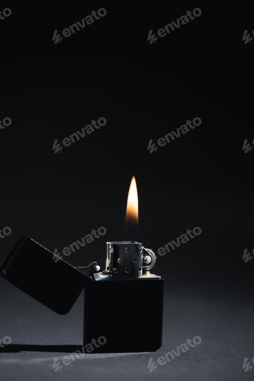 Preview: dark lighter with burning fire on black with copy space