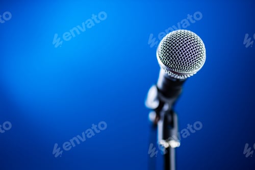 Preview: Microphone on stage against a background blue recording studio
