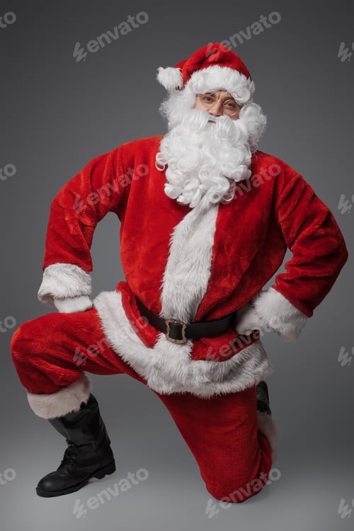 Preview: Christmas santa claus while sitting against gray background