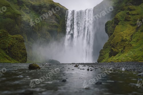 Preview: Famous and most visited Skogafoss waterfall in Iceland at evening light