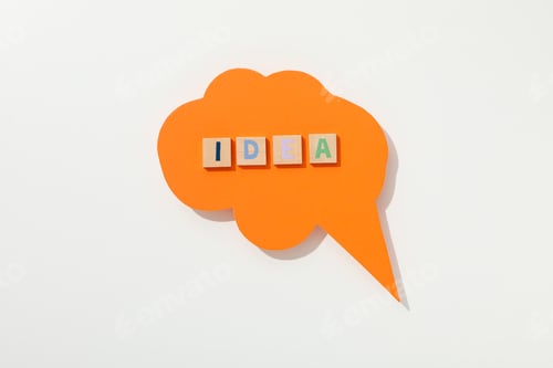 Visualização: A palavra: “ideia” disposta em letras sobre fundo branco.