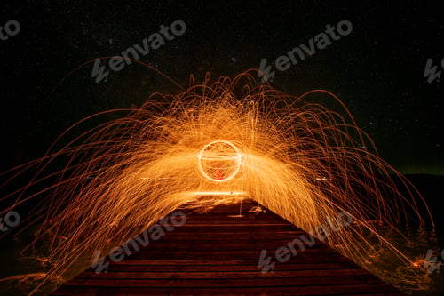 Preview: Fire dancer under show swing fire dancing on the beach ,he dance juggling with fire is extreme activ