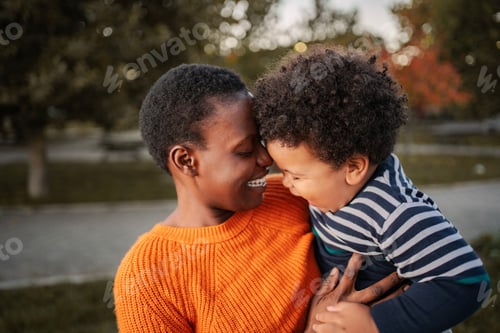 Preview: Mother and son bonding with affection outdoors