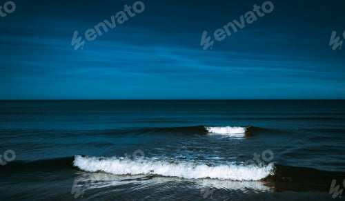 Preview: Calm night seascape with white waves