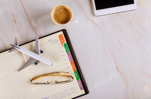 Preview: Travel office desk with notebook, glasses cup of coffee digital tablet