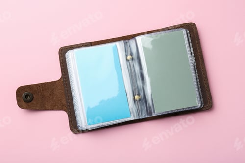 Preview: Leather business card holder with blank cards on pink background, top view