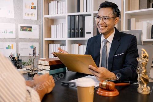 Preview: A professional lawyer discussing legal matters with a client in an office