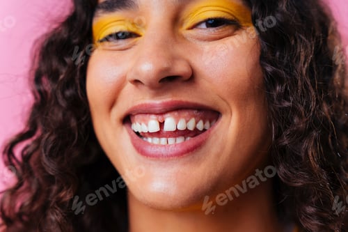Preview: Creative studio portrait of beautiful hispanic woman with diastema