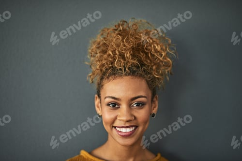 Preview: Woman with Curly Hair Smiling in Studio
