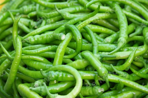 Preview: Heap of green hot chili pepper close up.