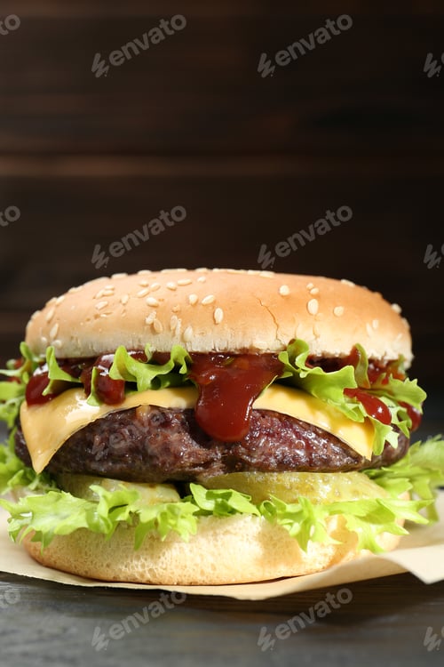 Preview: Burger with delicious patty on table, closeup