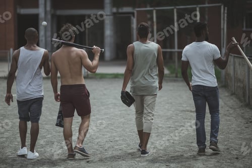 Preview: group of young multiethnic male baseball players on court
