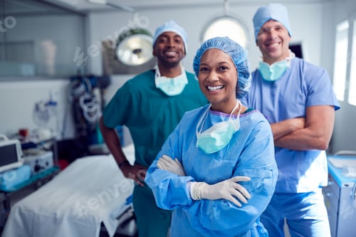 Preview: Portrait Of Multi-Cultural Surgical Team Standing In Hospital Operating Theater