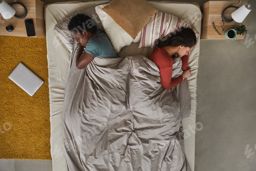 Preview: Multiethnic couple sleeping in the bedroom
