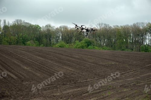 Preview: Drone Flying Over Farmland on an Overcast Day
