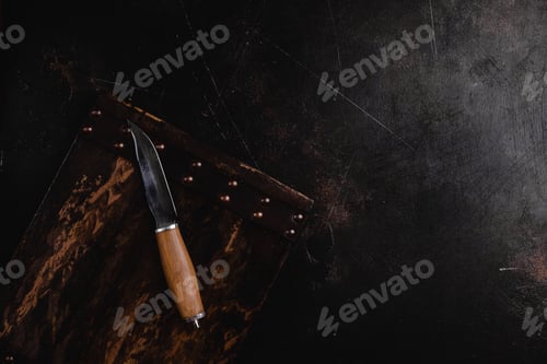 Preview: top view of wooden cutting board and knife