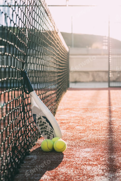 Preview: Padel blade racket resting on the net