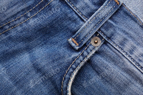 Preview: Denim Jeans Texture Background With Torn. The Texture Of The Colored Cotton Fabric. Stitched