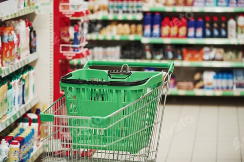 Preview: Green shopping car in modern market. Image focus technique