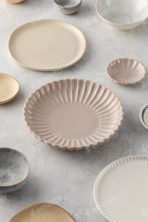 Preview: A variety of ceramic empty plates and bowls on the table. Kitchen, menu.