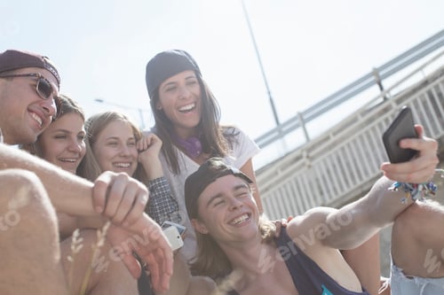 Preview: Friends taking selfie using smartphone