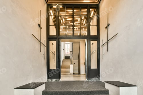 Preview: a lobby with stairs and a glass door