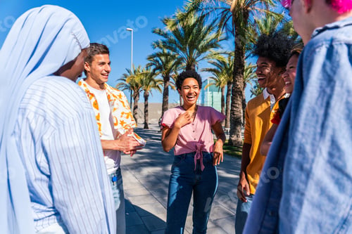 Preview: Multiethnic group of young happy friends hanging out