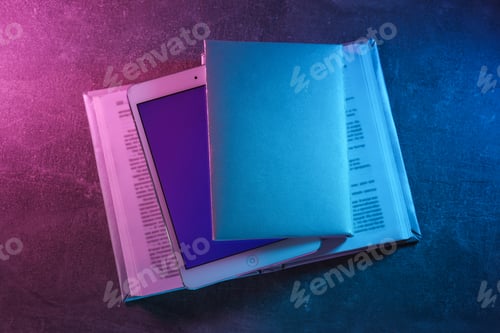 Preview: Books with a tablet and a keyboard, on a light background.