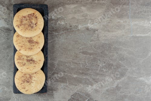 Preview: Homemade cookies stuffed with chocolate on black plate