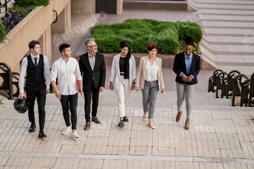 Preview: Dynamic Corporate Team Walking Together in Business District