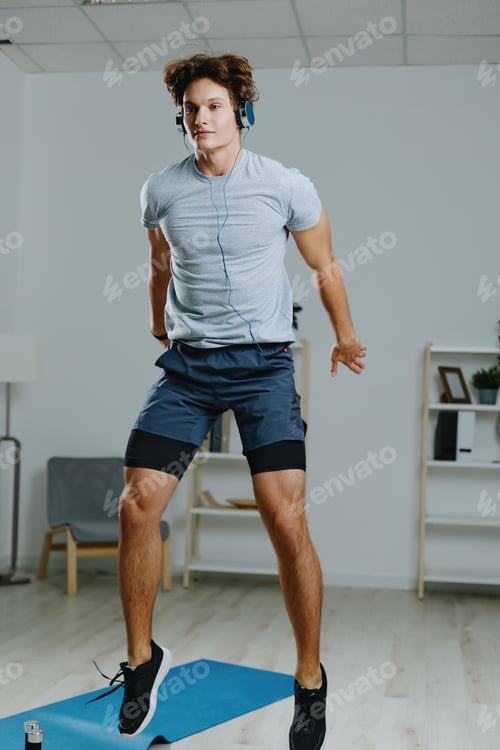 Preview: man gray sport headphone home technology indoor activity lifestyle healthy training