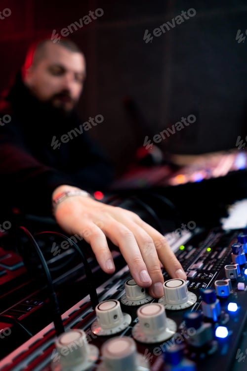 Preview: close up the recording room dark with neon lighting in the studio the sound engineer works with the