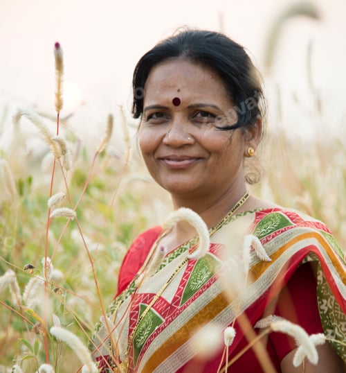 Preview: Smiling woman farmer in agricultural field