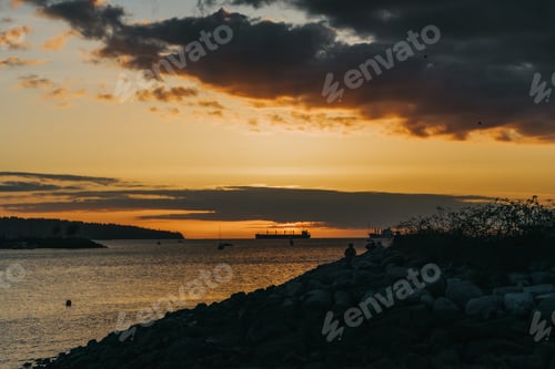 Preview: a view of a boat out on the water at sunset