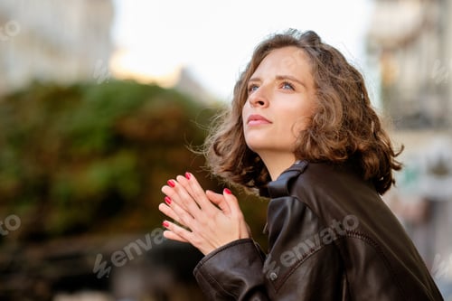 Preview: Woman in Brown Jacket Looking Upward Outdoors