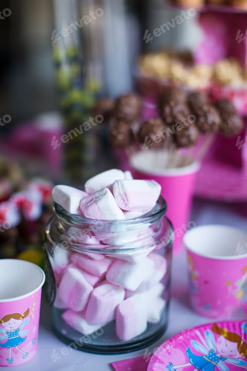 Preview: Marshmallow, sweet colored meringues, popcorn, custard cakes and cake pops on table