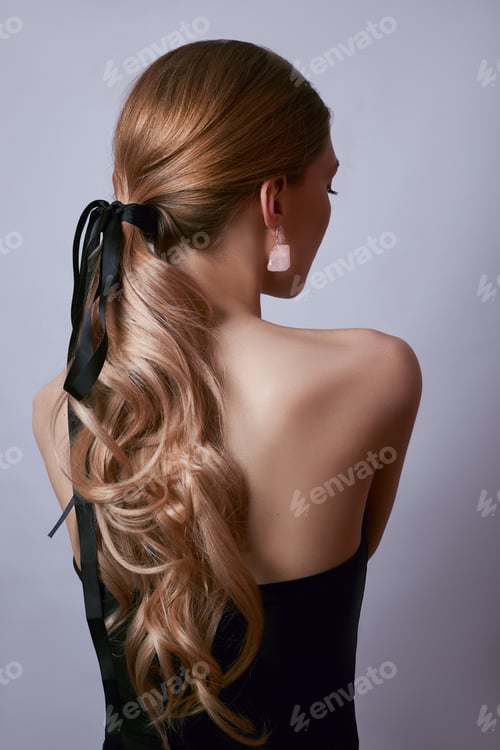 Preview: Woman Showcases Elegant Earrings and Hairstyle