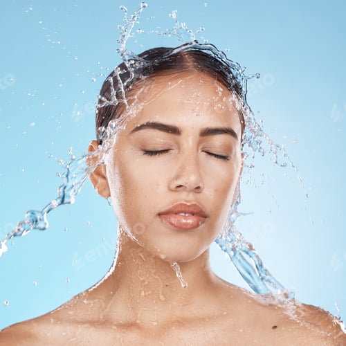 Preview: Woman, washing face or water splash skincare on blue background studio in healthcare wellness, Braz