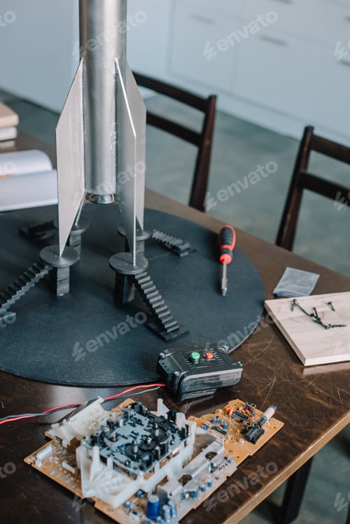 Preview: rocket model and microcircuit on table in kitchen
